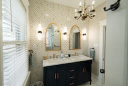 Double Vanity with Gold & White Tile Accent Wall